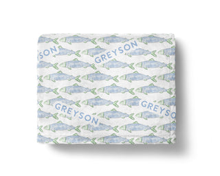 Personalized coastal baby blankets with tropical fish and nautical patterns, custom name printed.