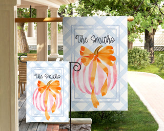 Personalized fall pumpkin garden flag with orange bow and family name, outdoor autumn yard décor