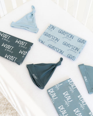 Custom name swaddle set for newborn boys with coordinating hospital hat