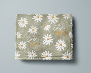 Personalized floral baby blankets with daisy and botanical prints, custom name printed.