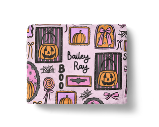 Personalized Halloween blanket with pumpkins, bats and spider webs in pink and orange
