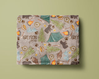 Personalized camping baby blanket with tents, campfire, and custom baby name