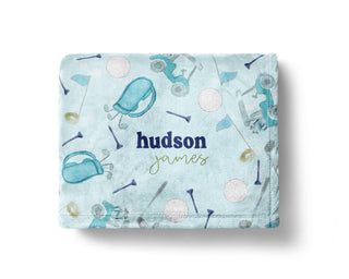 Personalized blue golf baby blanket with golf clubs, balls, and custom baby name
