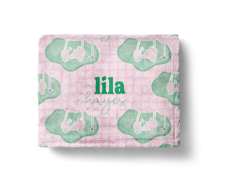 Personalized pink and green golf baby blanket with golf clubs and custom name