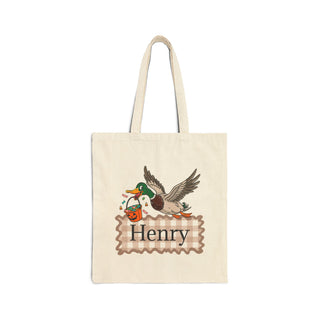 Personalized Halloween tote bags with cute spooky designs including bats, witches, pumpkins, ghosts, and more – custom name printed on each canvas bag for trick-or-treating.