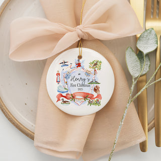 Custom ceramic ornament featuring a festive Nutcracker-inspired holiday design with red and blue details, personalized with baby name “Henry” and year 2025.