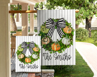 Striped seasonal garden flag featuring fall puppy design and personalized text