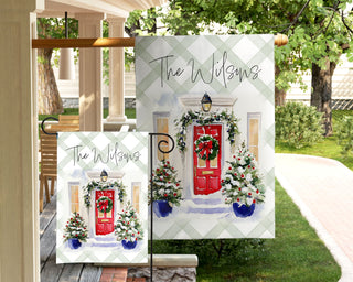 Elegant red door Christmas garden flag with garland and blue planters – The Navy Knot Christmas collection