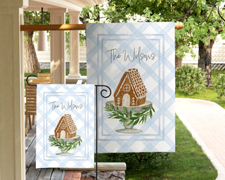 Personalized holiday garden flag with gingerbread house on cake stand – custom family name Christmas décor