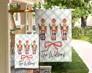 Personalized holiday yard flag with watercolor nutcracker soldiers and red ribbon – The Navy Knot Christmas collection