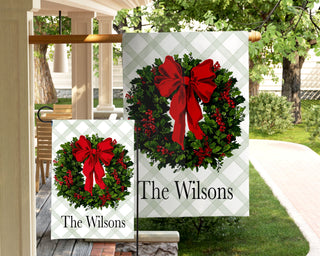 Elegant personalized wreath garden flag with classic red bow – custom family holiday yard décor