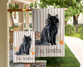 Personalized garden flag featuring a watercolor boxwood topiary with a peach ribbon bow and custom family name.