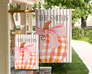 Custom garden flag with a boxwood topiary, decorative chinoiserie planter, and personalized family name for elegant porch decor.