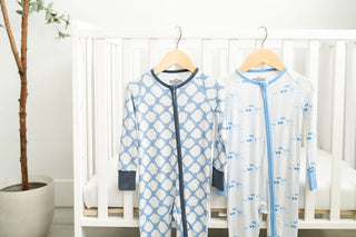 Close-up of blue fish print bamboo baby footie with two-way zipper