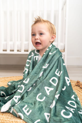 Cozy sherpa baby blanket with custom name design – perfect for toddler naps and snuggles.
