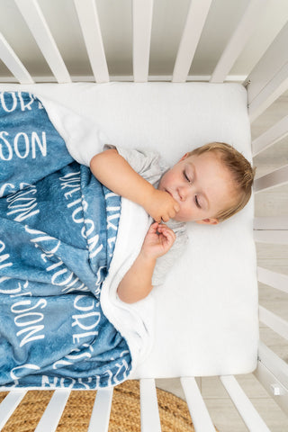 Personalized minky baby name blanket in soft blue – custom newborn gift and nursery essential.