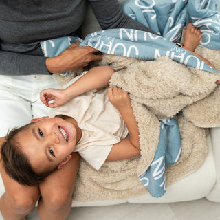 Personalized blue sherpa name blanket for toddler boy – soft custom baby blanket with name print, cozy gift for kids and moms, personalized toddler bedding by The Navy Knot.
