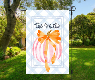 Elegant autumn garden flag with watercolor pumpkin, orange ribbon, and custom family name
