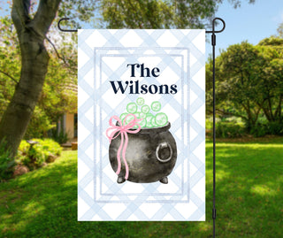 Striped Halloween garden flag featuring bubbling witch cauldron with bow – personalized porch and lawn decoration