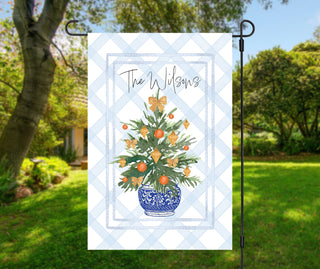 Personalized Christmas garden flag with citrus tree in blue chinoiserie planter and gold bows – The Navy Knot holiday décor