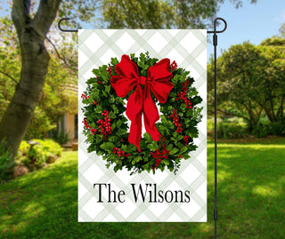 Personalized Christmas garden flag with festive green wreath and red bow – The Navy Knot holiday yard décor