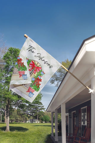 Custom Christmas door garden flag with festive red ribbon and greenery – personalized outdoor holiday decoration