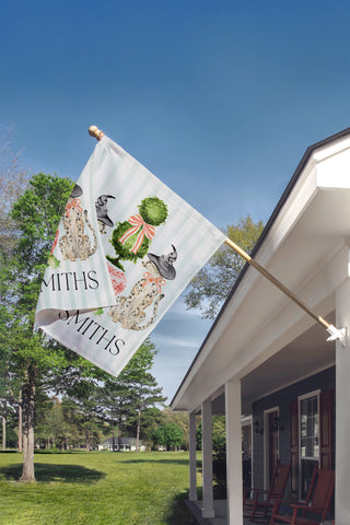 Personalized Halloween yard flag featuring Staffordshire-style dogs, witch hats, a pink chinoiserie planter, and a custom family name.