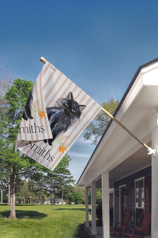 Custom garden flag with a boxwood topiary, decorative chinoiserie planter, and personalized family name for elegant porch decor.