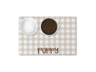 Non-slip personalized pet mat for food and water bowls.