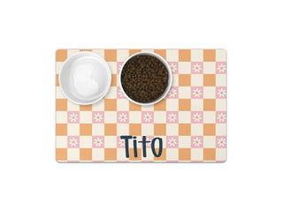 Durable personalized dog placemat with paw print design.