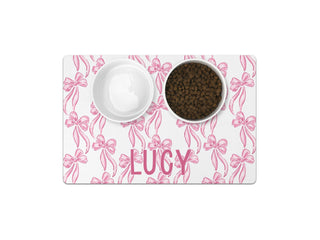 Cute custom puppy feeding mat with name in script font.