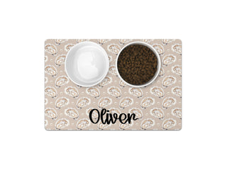 Custom pet feeding mat featuring a pink floral trellis pattern personalized with your pet's name.