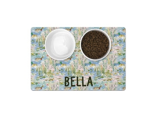 Personalized pet feeding mat with a watercolor duck marsh pattern and custom pet name for food bowls.
